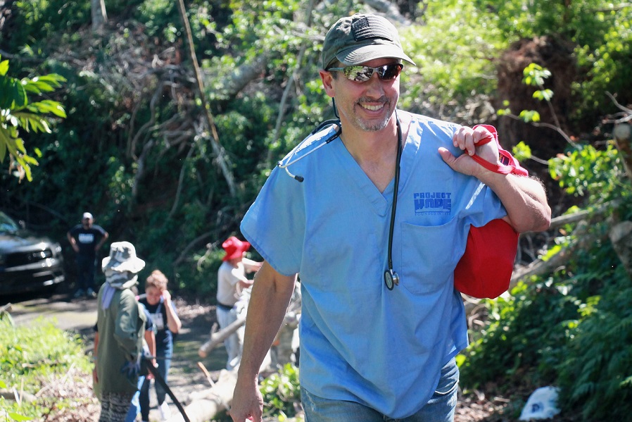 Dr Paco holding bag