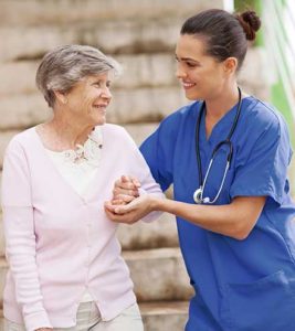 Nurse helping senior lady